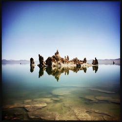 Scenic view of calm sea against clear sky