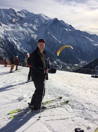 Full length portrait of man skiing on snowcapped mountain