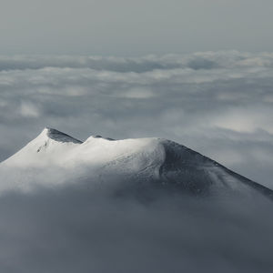 Snow covered mountain against sky