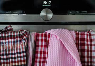 Close-up of clothes hanging on rack in store