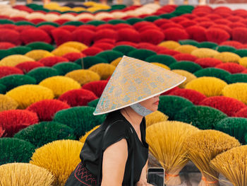 Vietnamese woman with silk conicalhat in quang phu cau incense villag