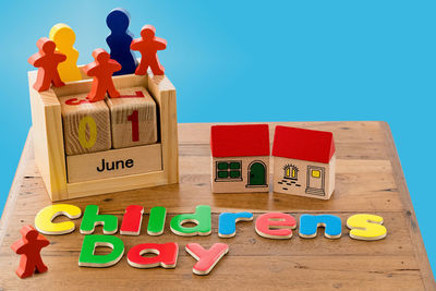 Toys and children day text over blue background