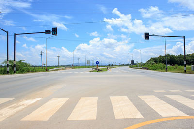 Rear view of man on road against sky