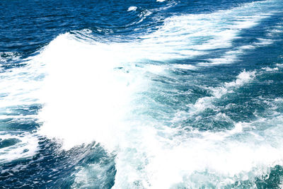 High angle view of waves splashing in sea