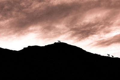 Low angle view of silhouette mountain against sky during sunset