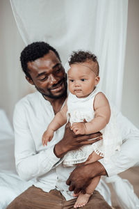 Portrait of happy mother with baby