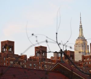 Buildings in city against sky