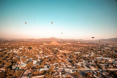 Aerial view of city against clear sky