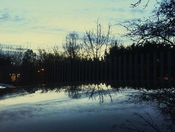 Scenic view of trees against sky during sunset