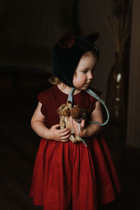 Toddler baby girl in funny hat with ears having fun