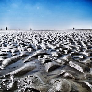 Scenic view of beach against clear sky