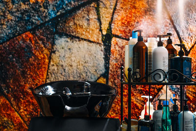 Beauty products and ceramic sink at hair salon