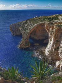 Scenic view of sea against blue sky