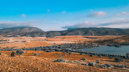 Scenic view of landscape and mountains against sky