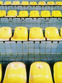 Empty yellow bleachers in stadium