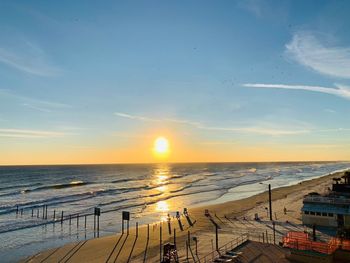 High angle view of sea against sky during sunset