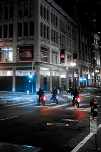 People on city street at night