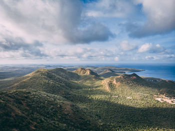 Panoramic view of land and sea against sky