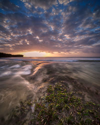 Scenic view of sea against sky during sunset