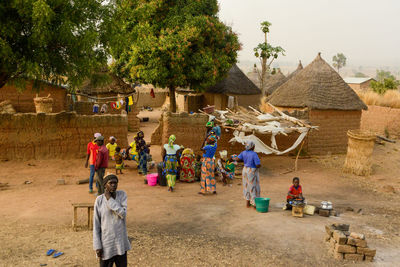 Group of people in front of village