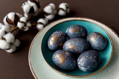 High angle view of blueberries in bowl on table