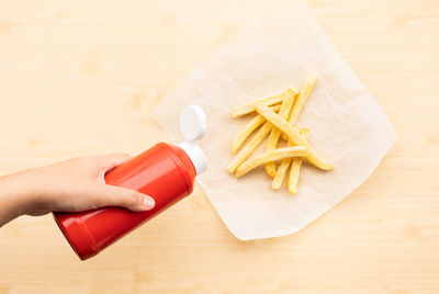 High angle view of person preparing food on table