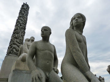 Low angle view of statue against sky