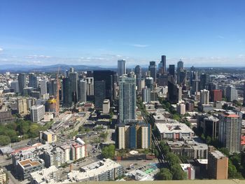 High angle view of modern buildings in city against sky