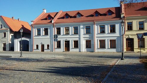 Residential buildings against blue sky