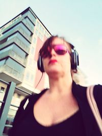 Portrait of man wearing sunglasses against sky