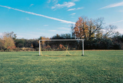 Low angle view of soccer field against sky