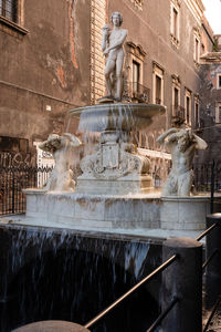Fountain in front of historical building