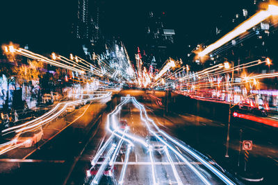 High angle view of light trails on road at night