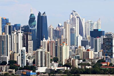 Modern buildings in city against sky