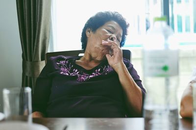 Senior woman sitting at table