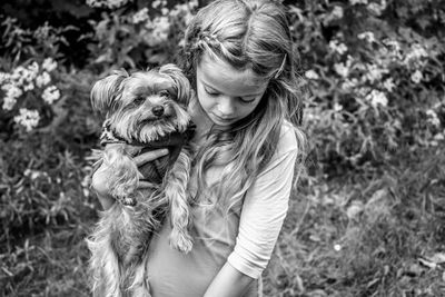 Woman with dog on field