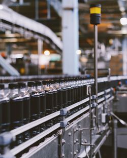 Bottles on conveyor belt at factory