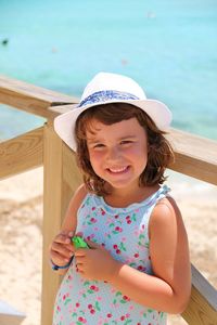 Happy girl standing on beach