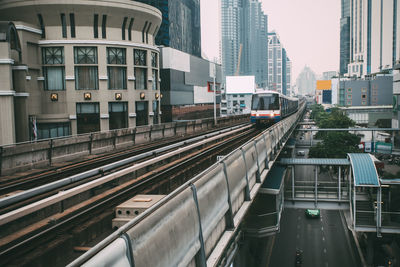 High angle view of railroad tracks amidst buildings in city