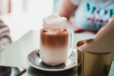 Close-up of coffee cup on table