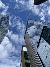 Low angle view of modern buildings against sky