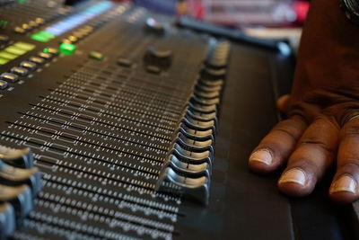 Close-up of sound mixer in recording studio