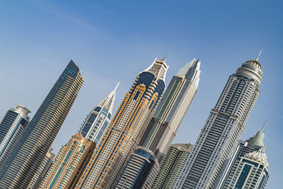 Low angle view of modern buildings against clear sky