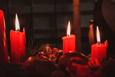 Burning candles with christmas decorations