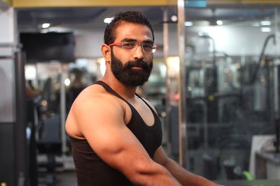 Portrait of smiling bearded man at gym