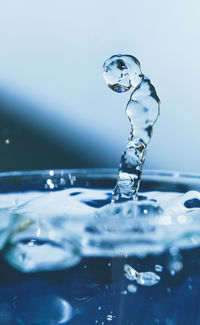 Close-up of water splashing against white background