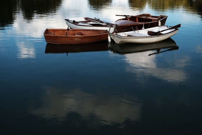 Boats moored in lake