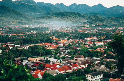 High angle view of townscape and mountains