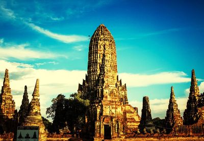 Low angle view of temple against cloudy sky