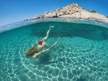 Woman swimming in sea